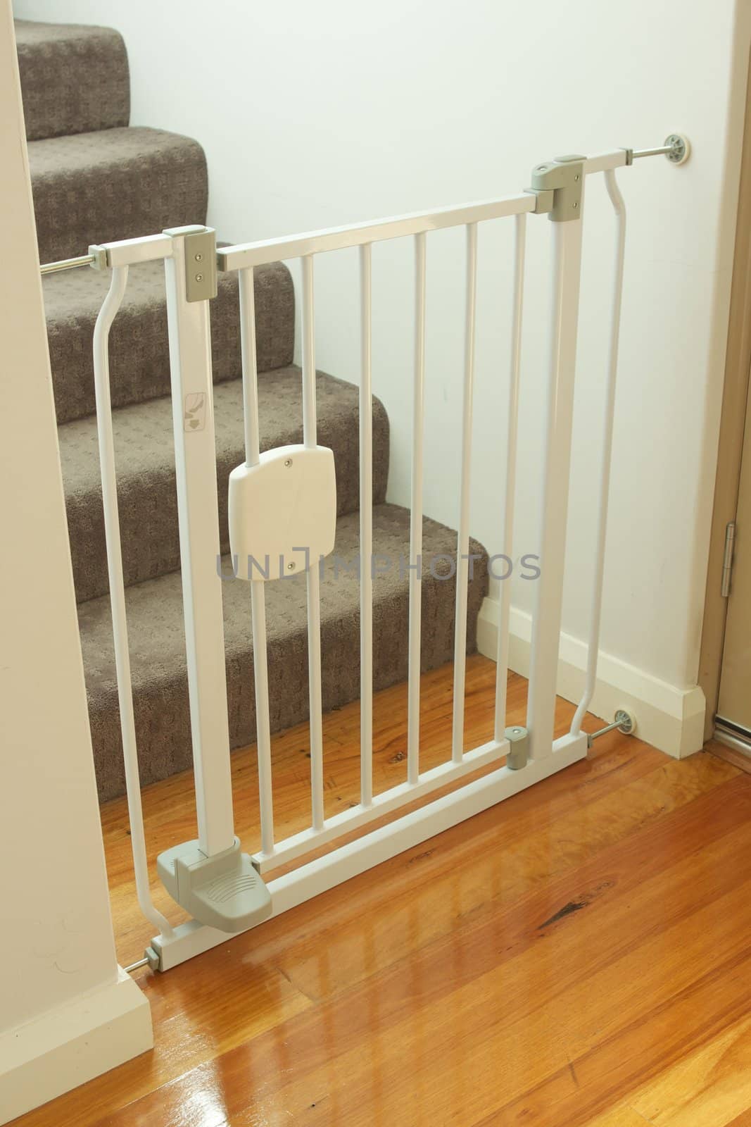 A shot of a child safety gate and stairs