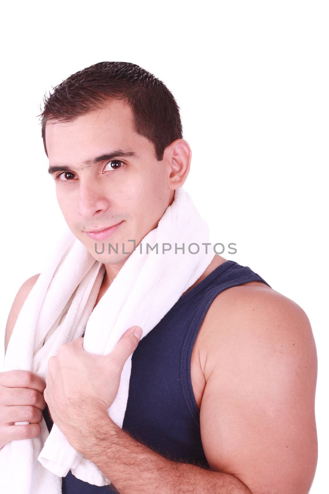 A young man just finishes his workout and with towel over his sh by dacasdo