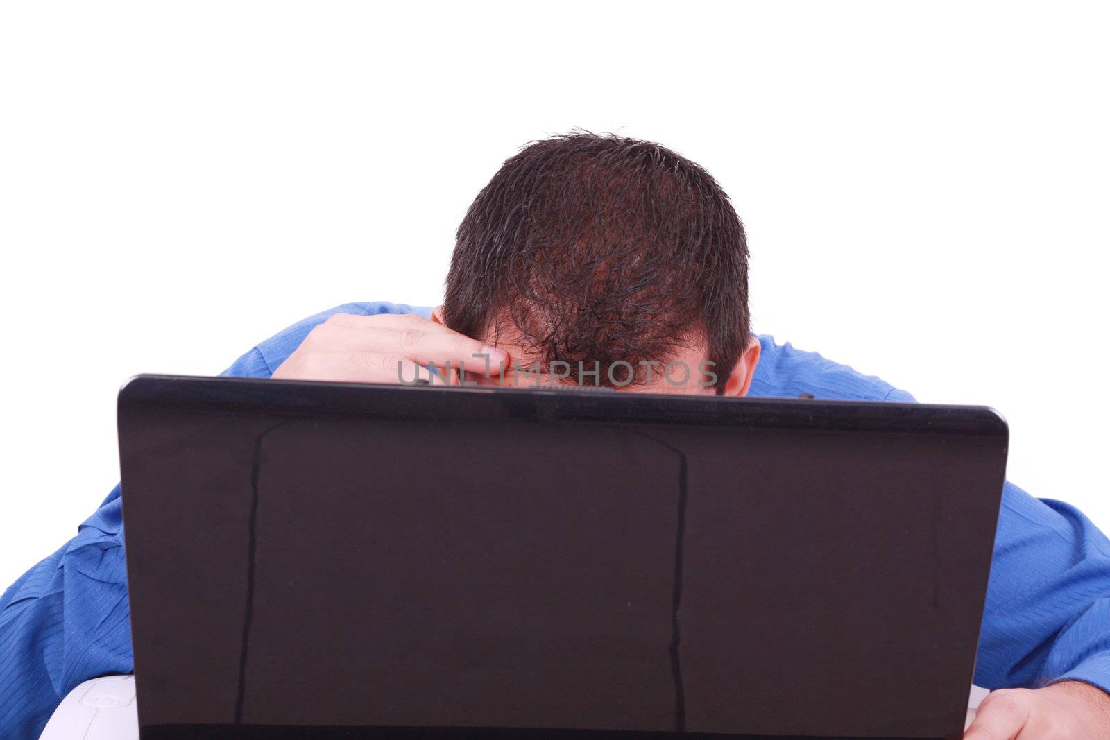 A bald man hiding behind his laptop computer screen.