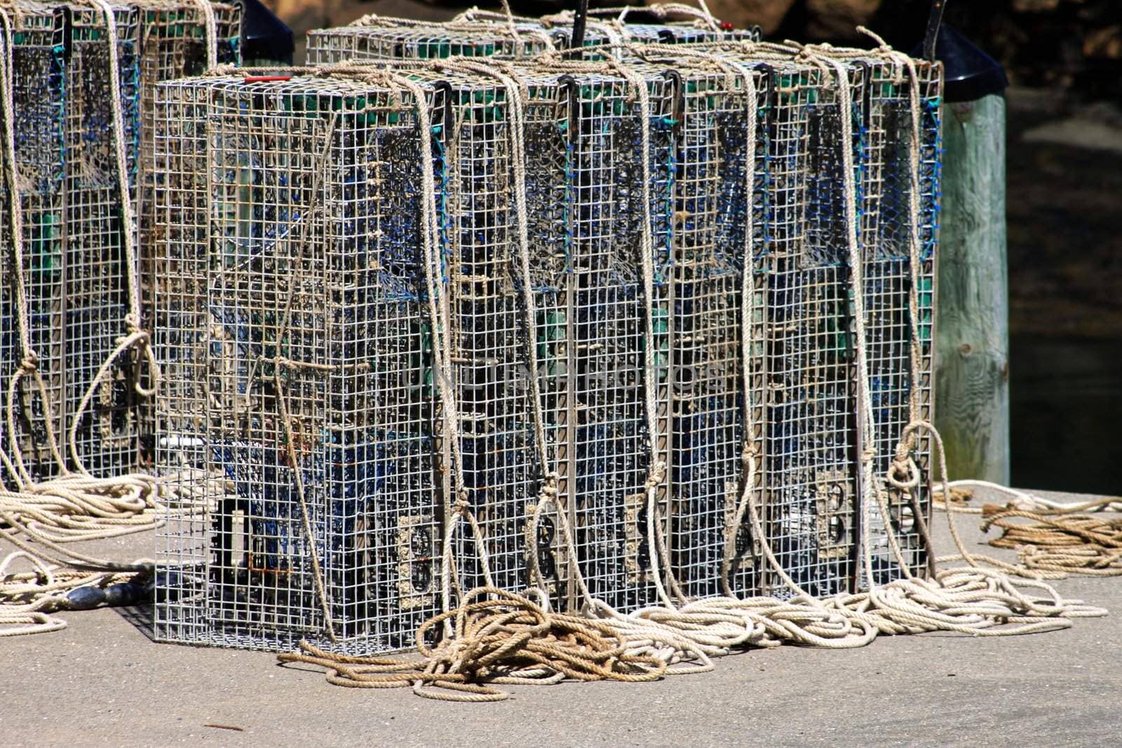Line of lobster cages on a fishing pier