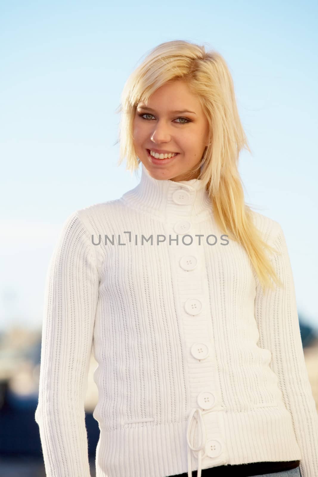 Teenage girl looking at camera, smiling