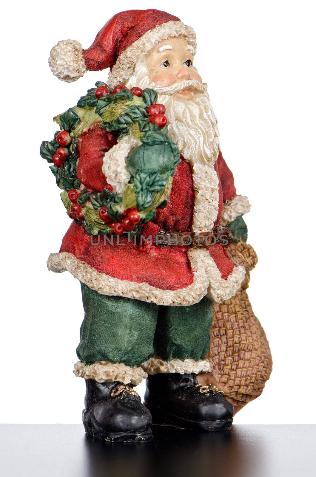 Ceramic Santa Claus isolated on white background.