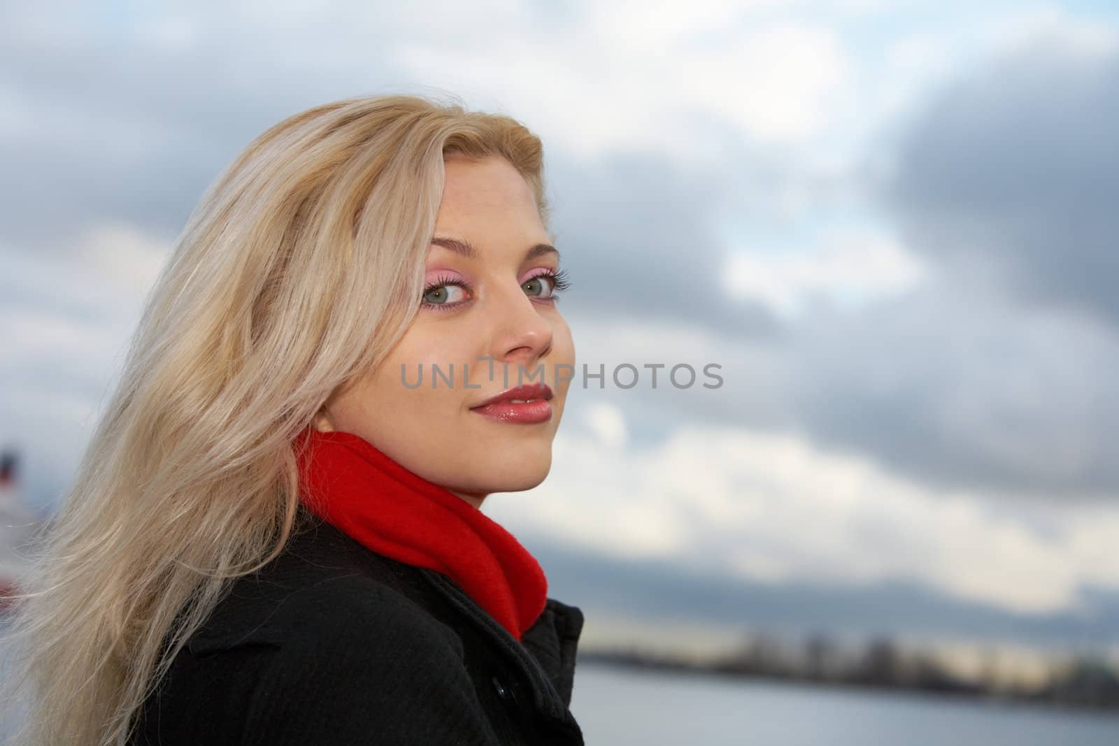 Young woman looking at camera outdoors