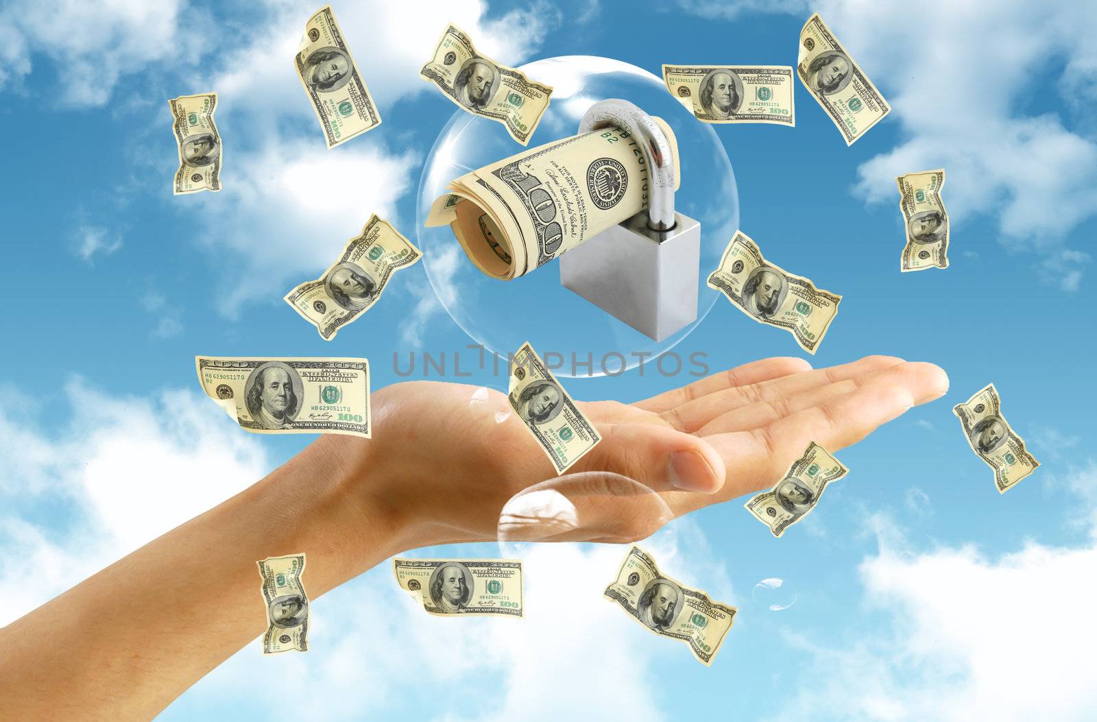 american dollar in hand on blue sky background by rufous