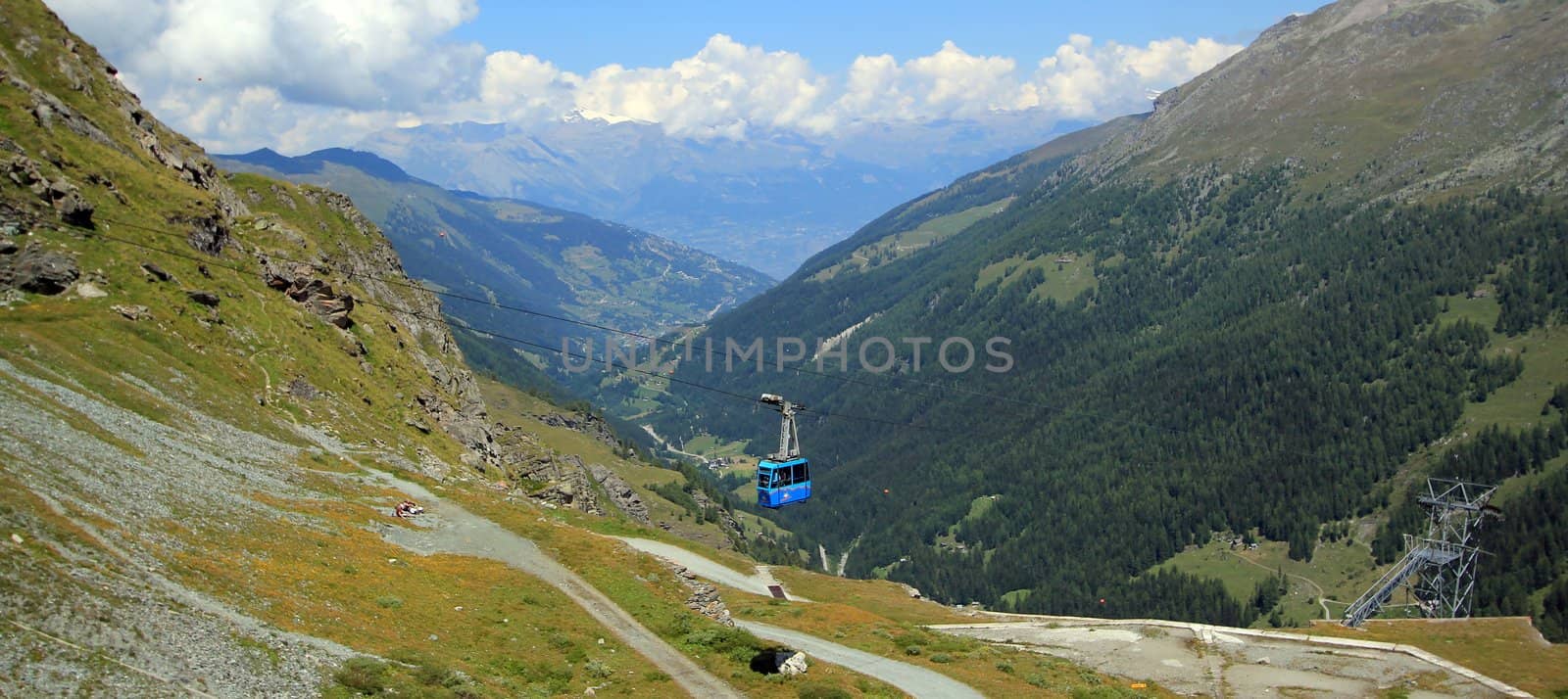 View on the valley and cable car from the Grande Dixence Dam by summer, Valais, Switzerland