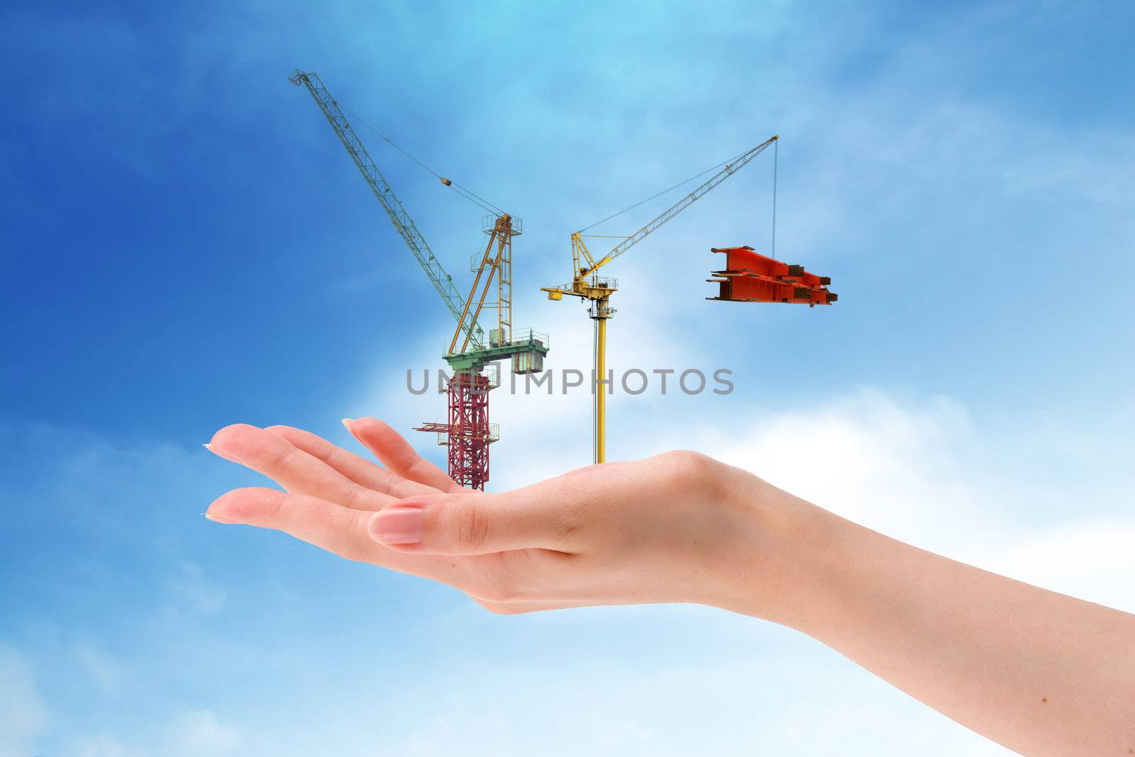 Business   in construction crane area over blue sky by rufous