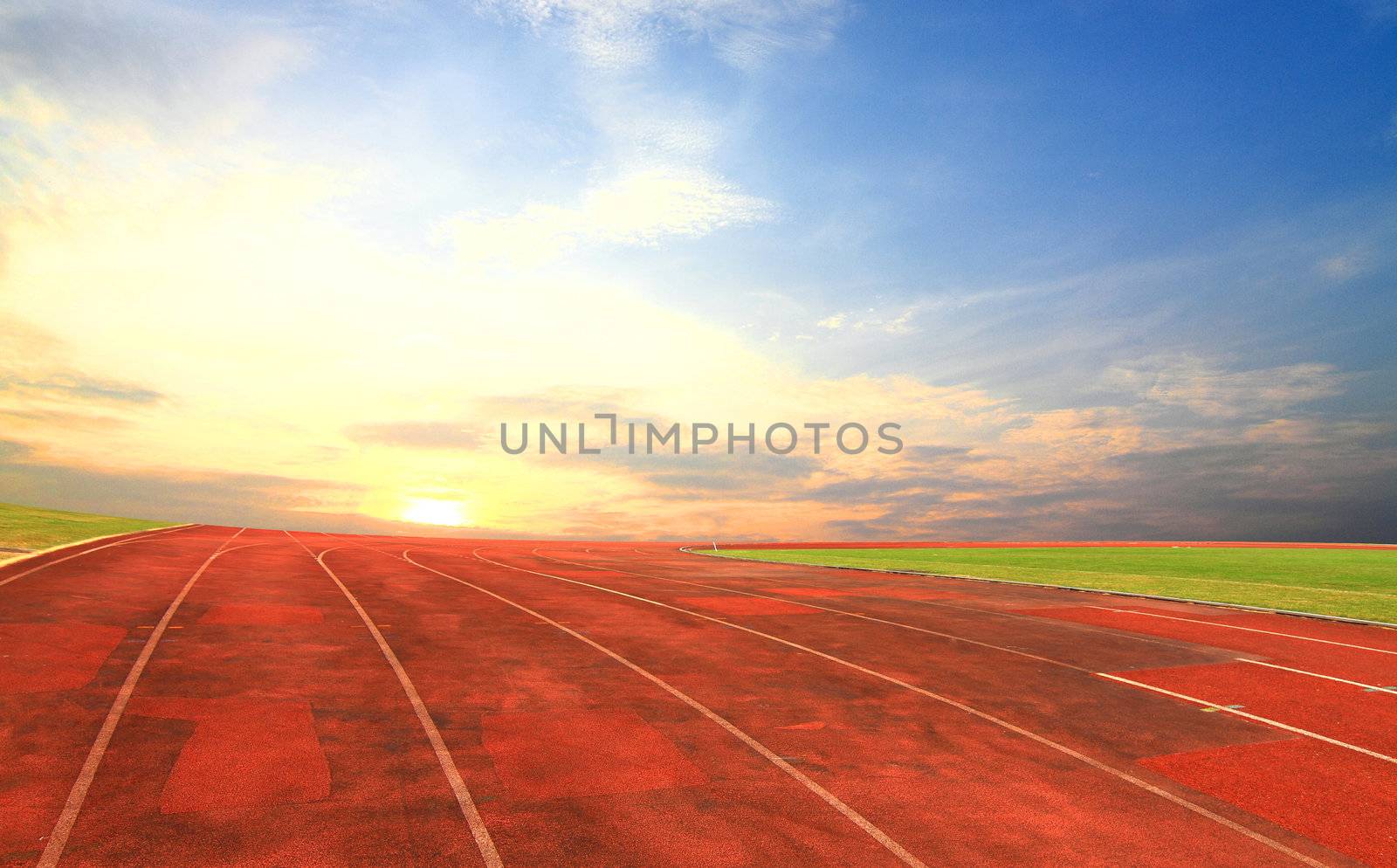 Running track with one lanes with sky sunset