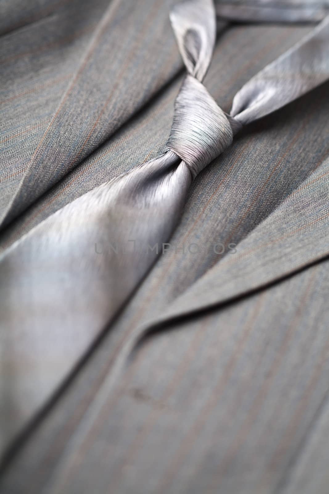 A modern tie and a gray costume