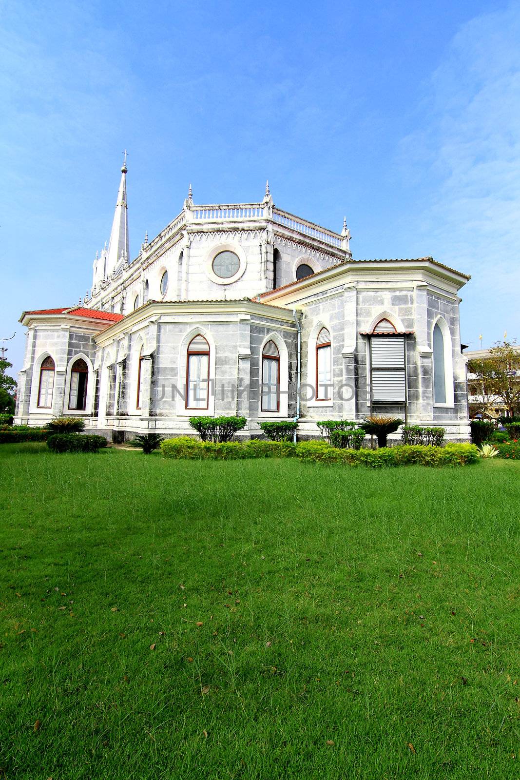 Christian church in Thailand against a backdrop of sky by rufous