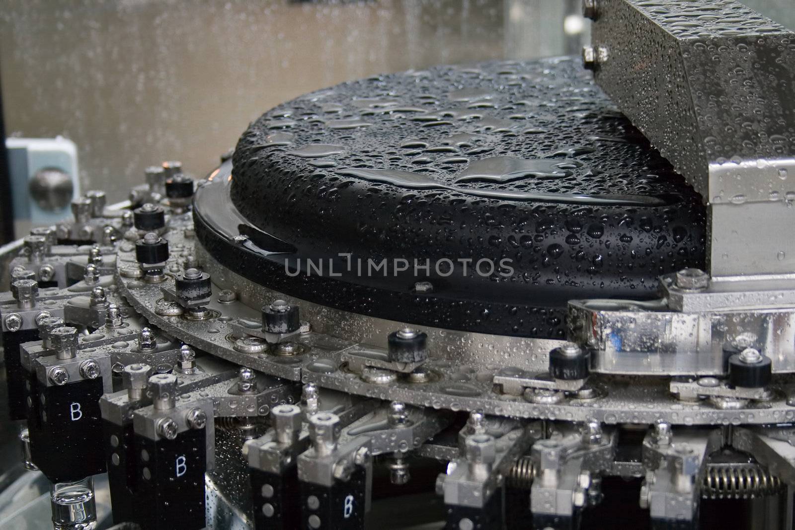 Part of a machine washing bottles at the factory for the production of medicines