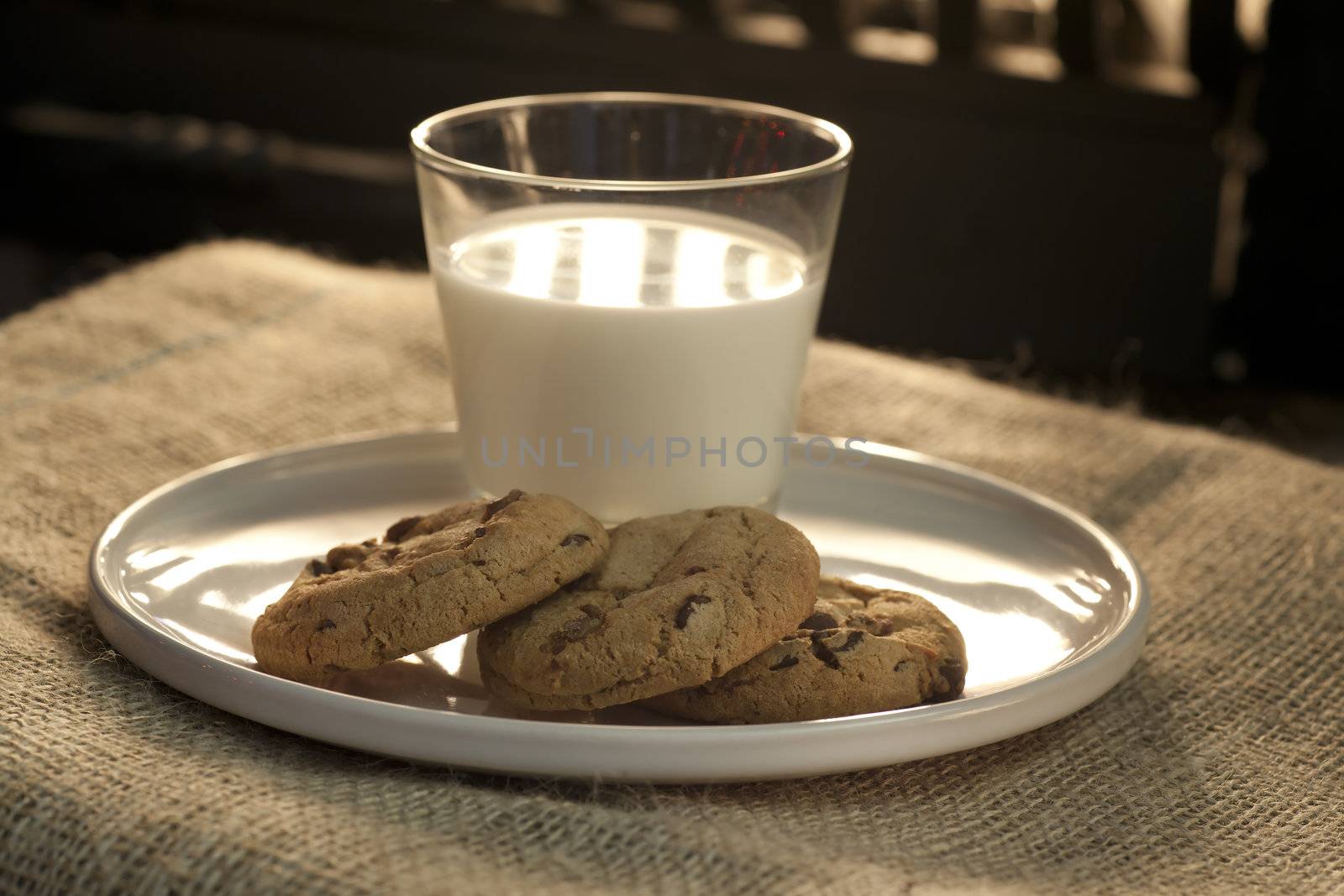 Three cookies and a glass of milk set out on Christmas Eve for Santa Claus