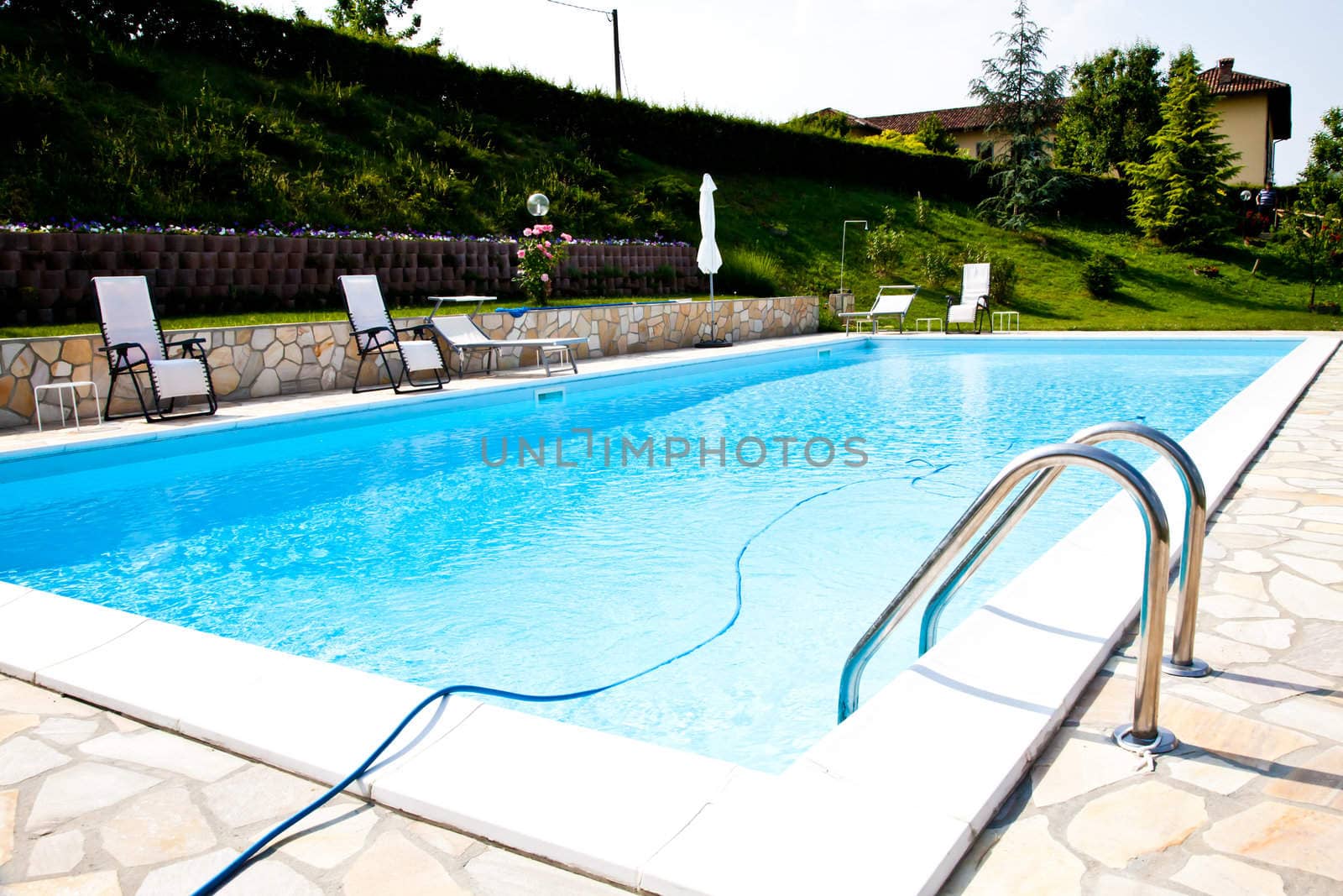 Swimming pool of an Italian beauty farm in the middle vineyards, Monferrato area, Piemonte region.