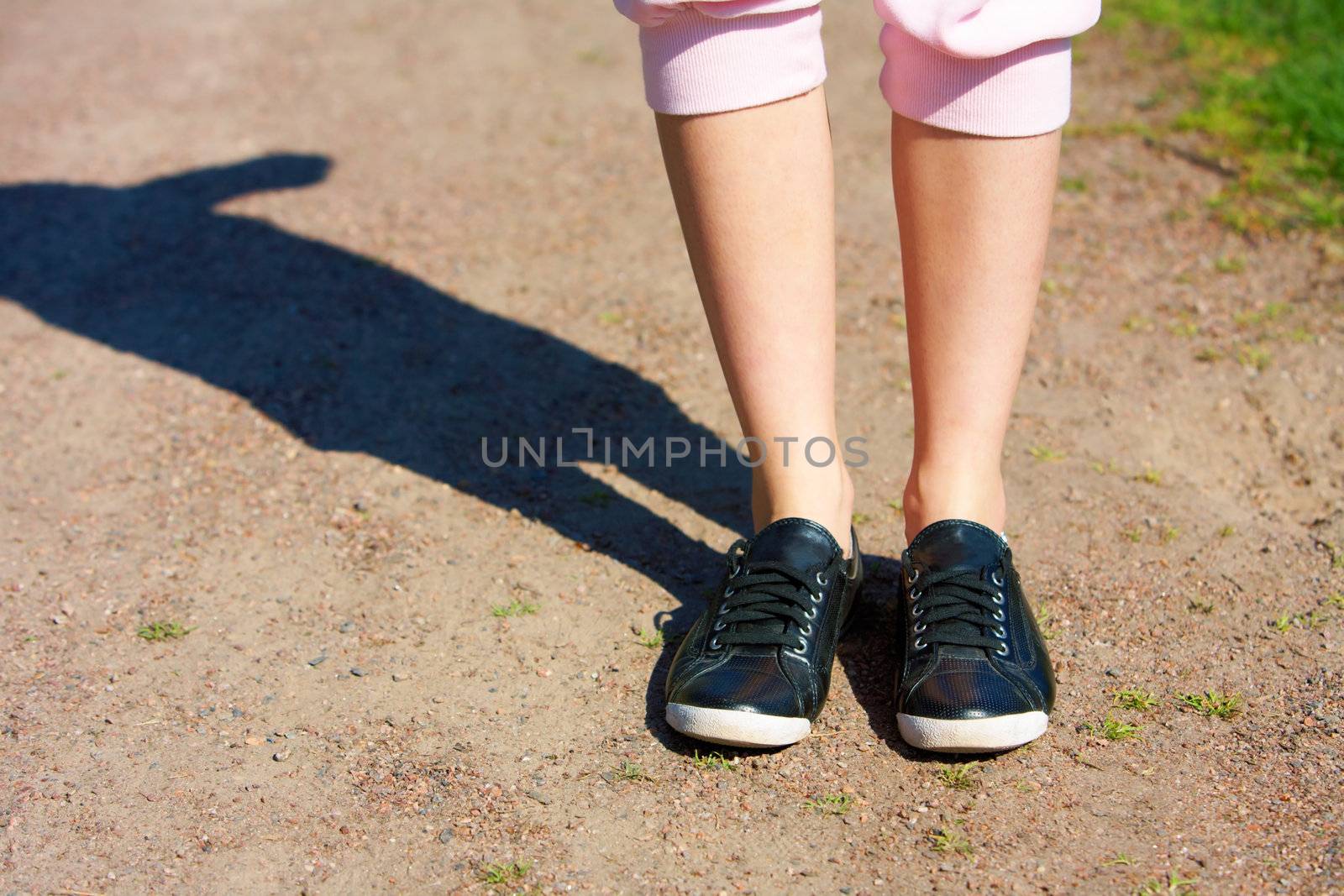 Shoes of teenage girl jogging