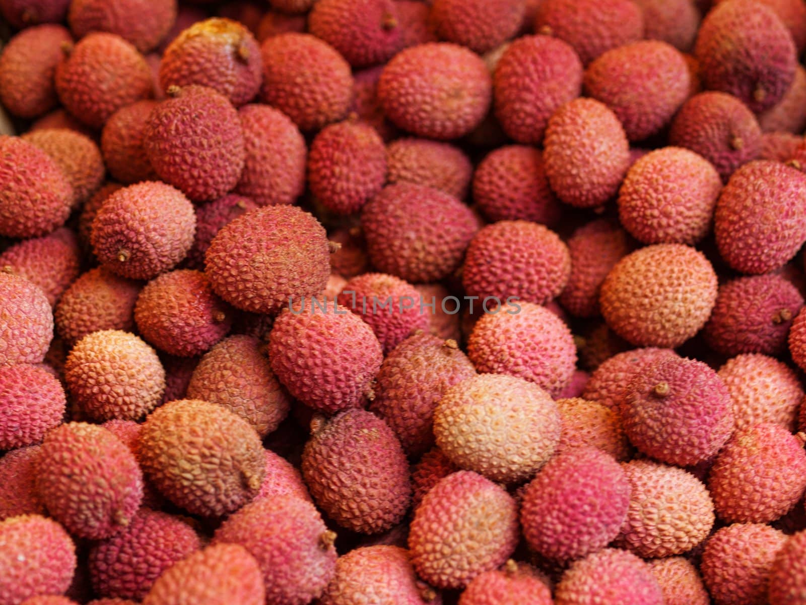 Closeup of a stack of red lychees