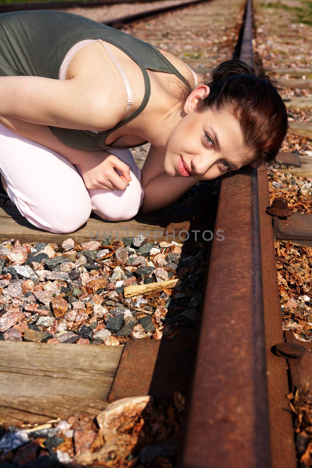 Teenage girl listening to rails