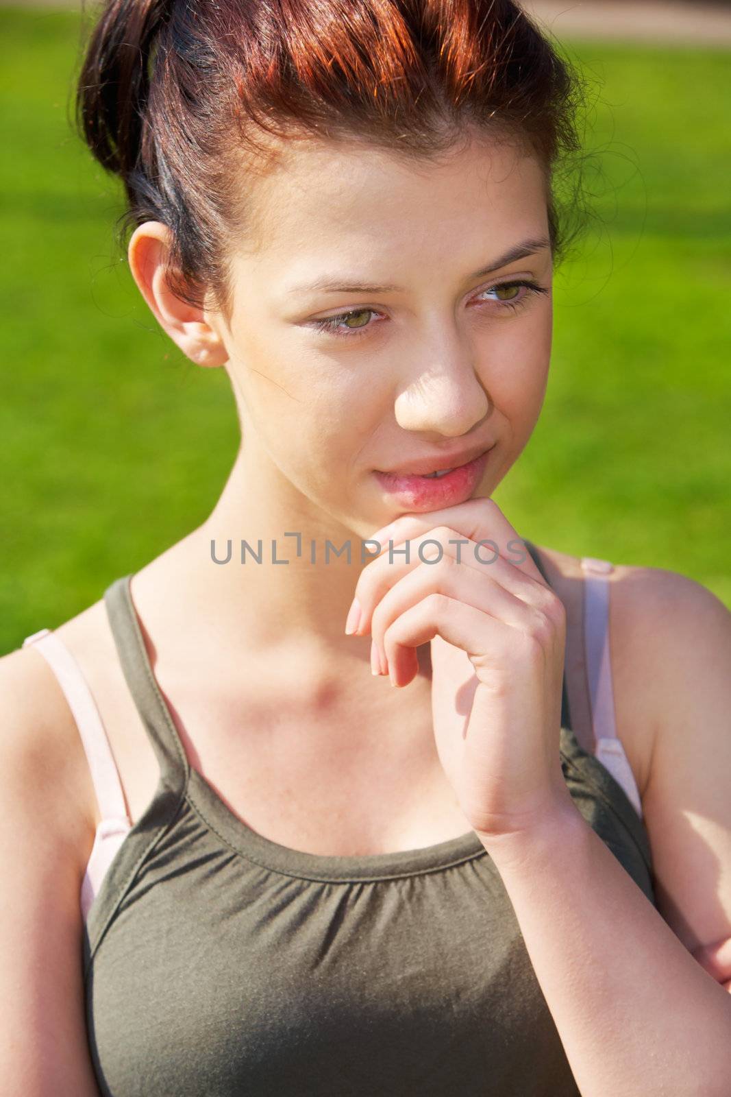 Teenage girl contemplating outdoors