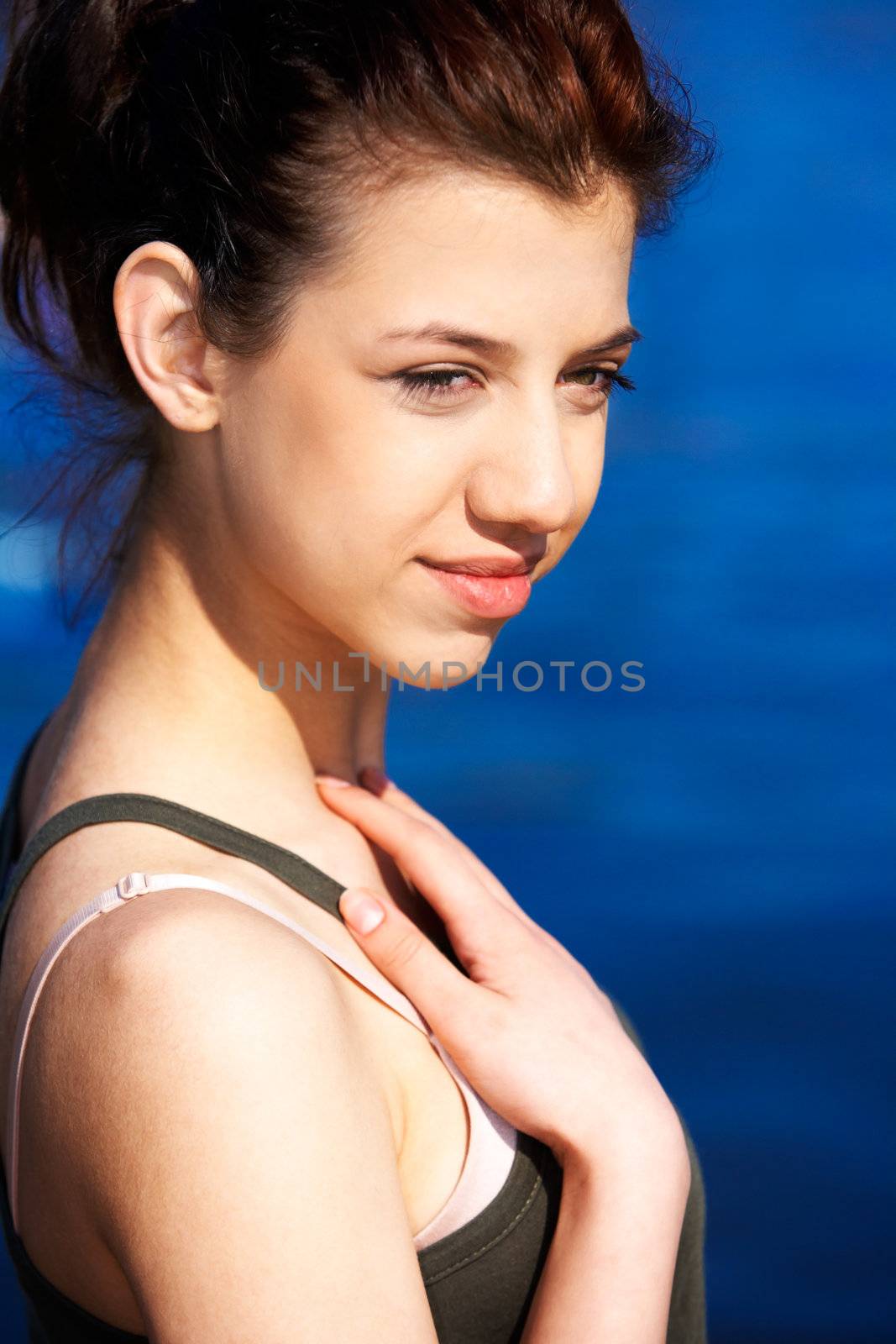 Portrait of teenage girl by sea