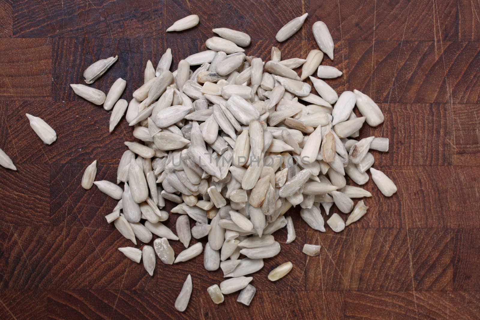 Healthy sun flower seeds on a wooden bg