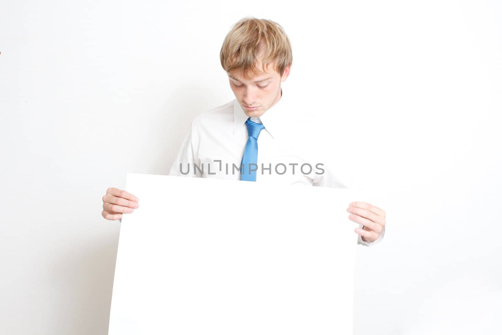 Business man looking down on sign