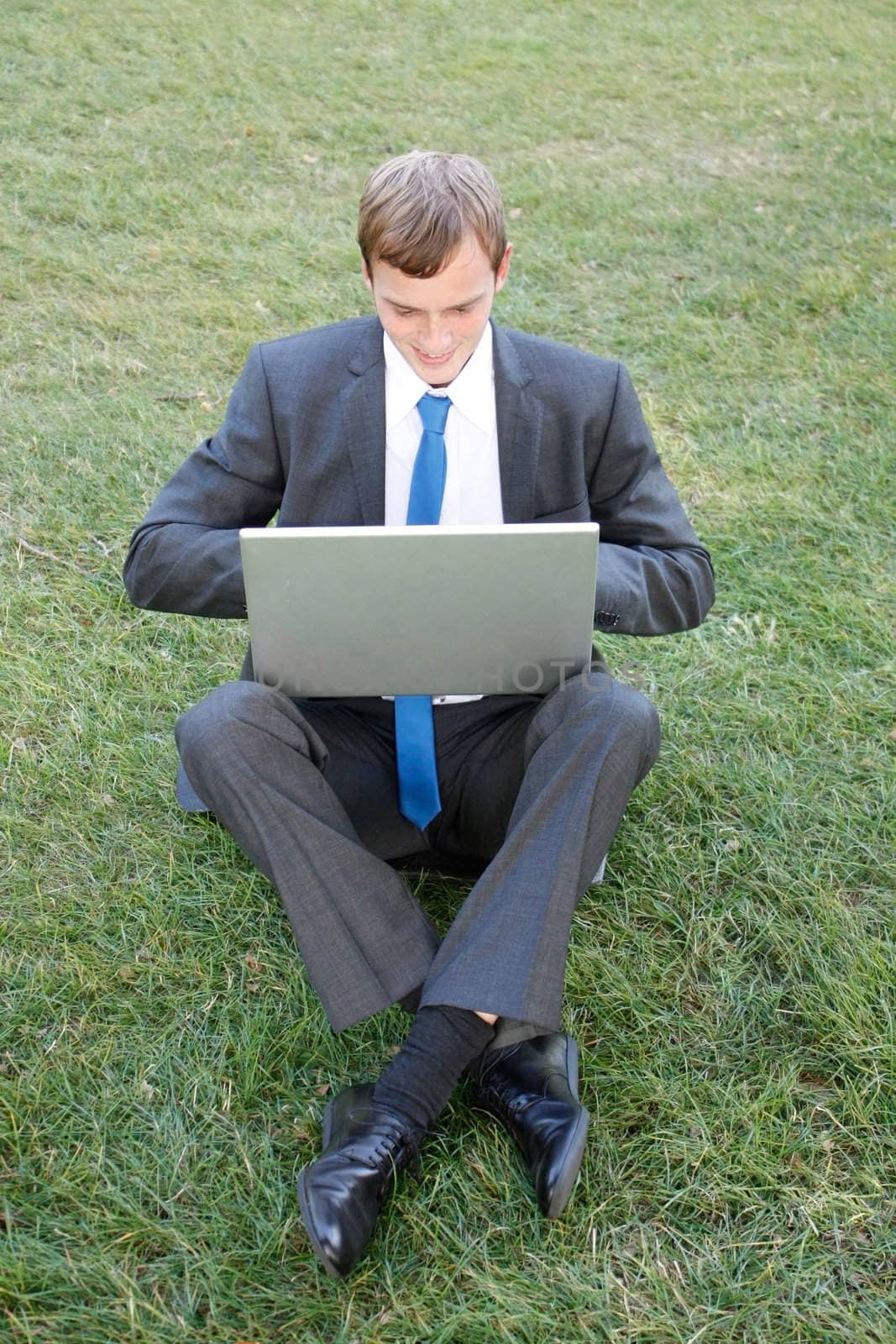 Business man sitting in the park