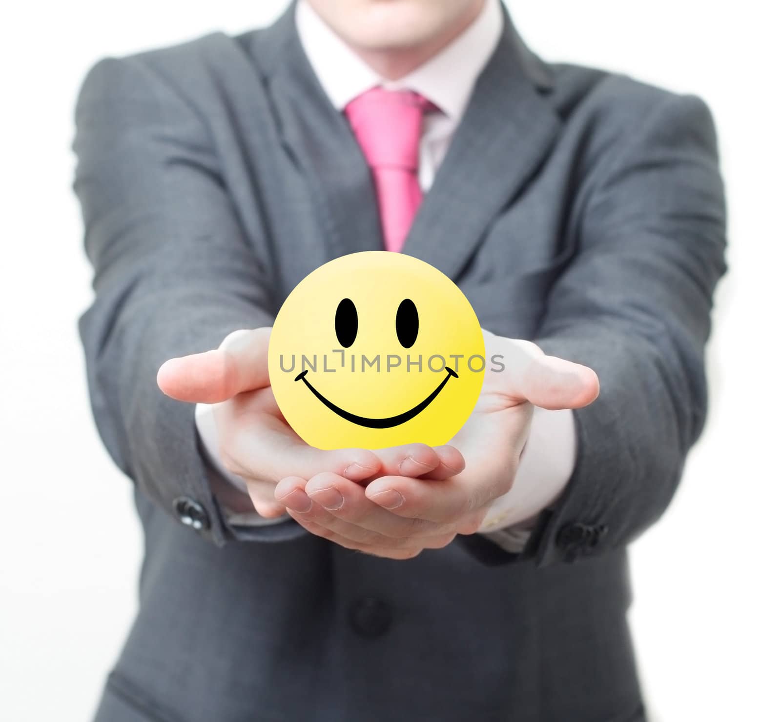 Businessman holding smiley