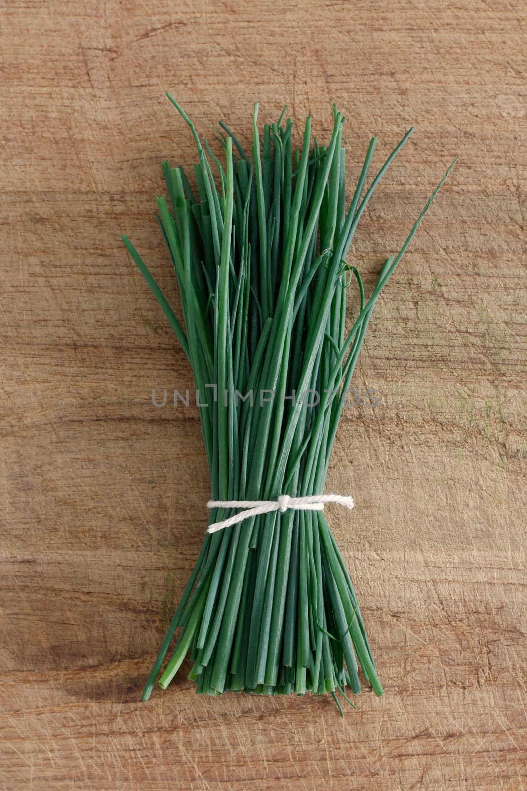 Chives on a wooden surface