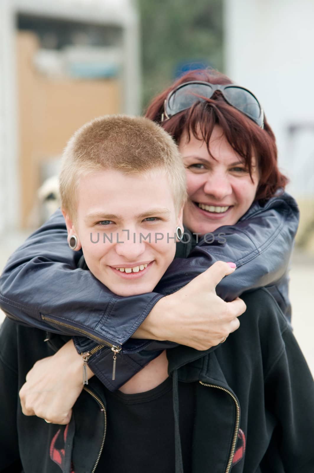 The happy mother and a son hugging and laughing