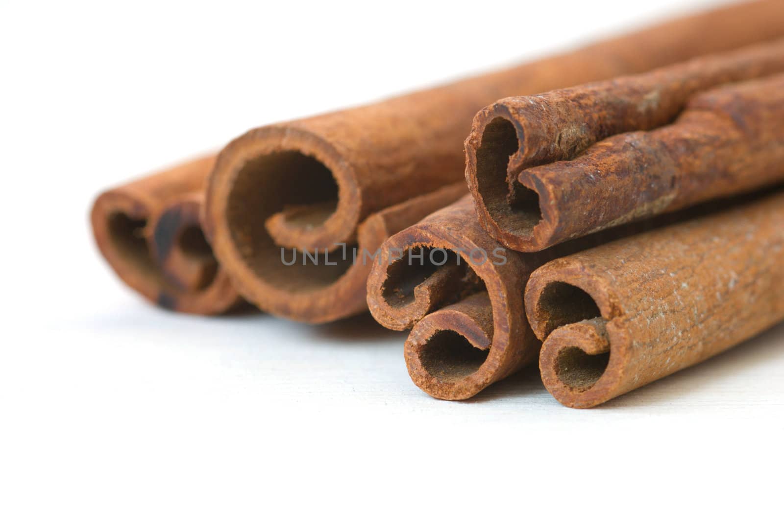 Cinnamon sticks on white background macro