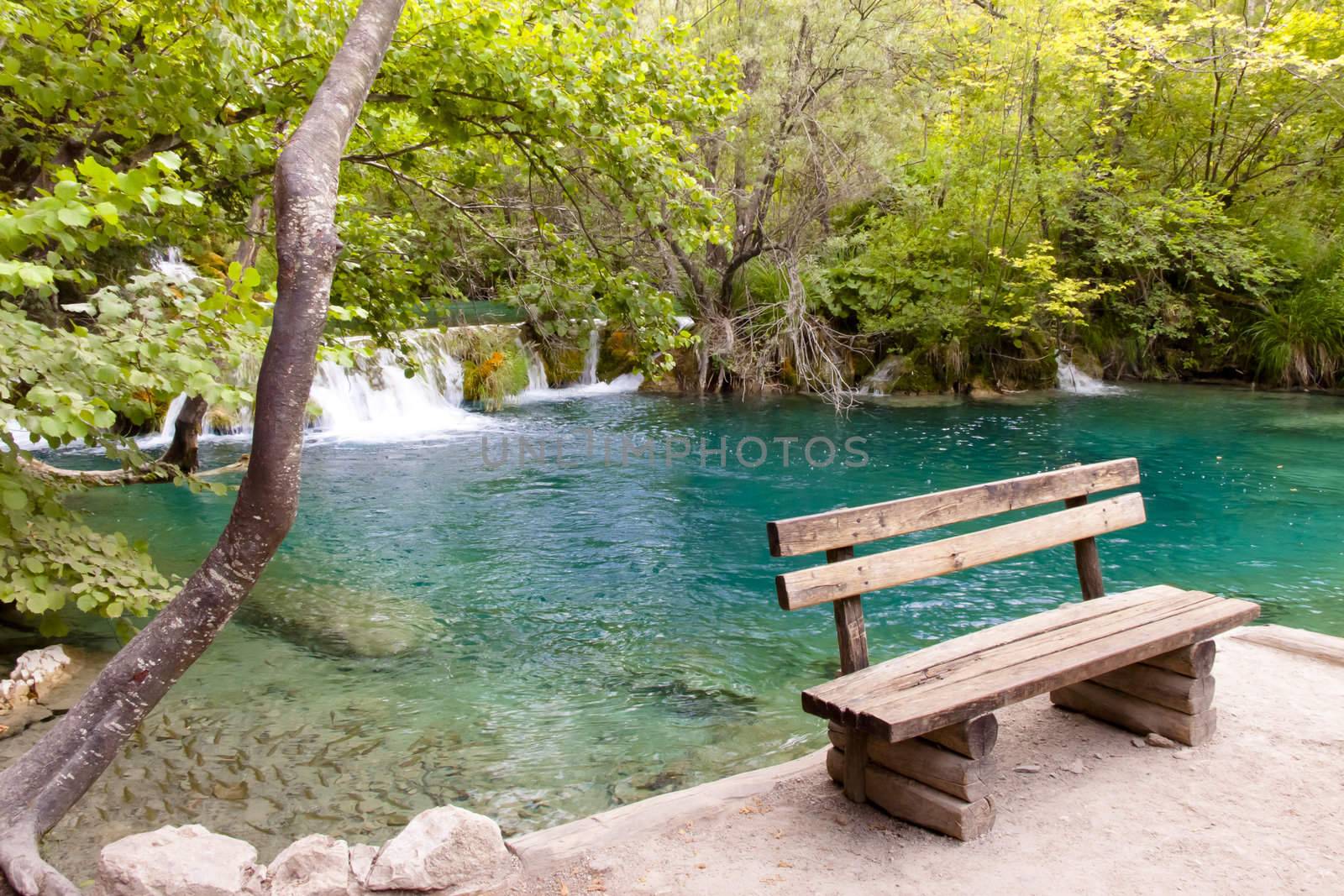 Wooden bench in Plitvice lakes by parys