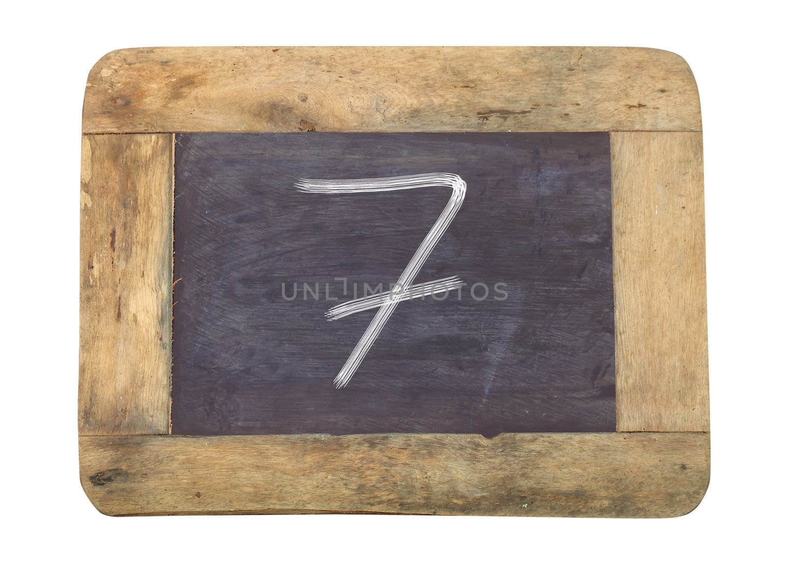 The number "7" written with white   on a blackboard   by rufous