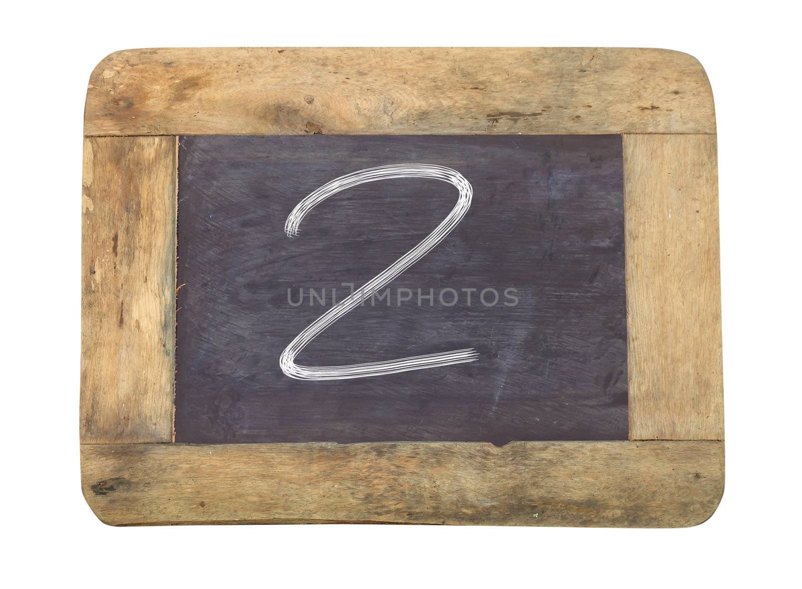 The number "2" written with white   on a blackboard   by rufous