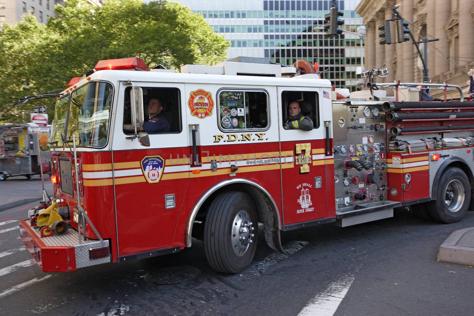 New York City, New York, USA - October 9, 2010: New York City Firefighters in a fire engine rushing to an emergency.