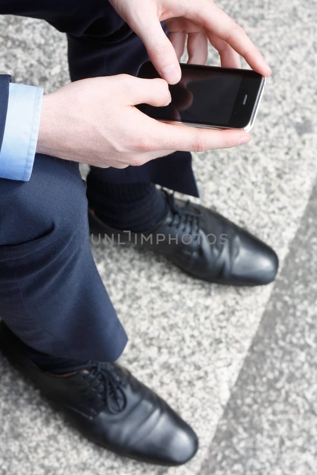 Businessman texting