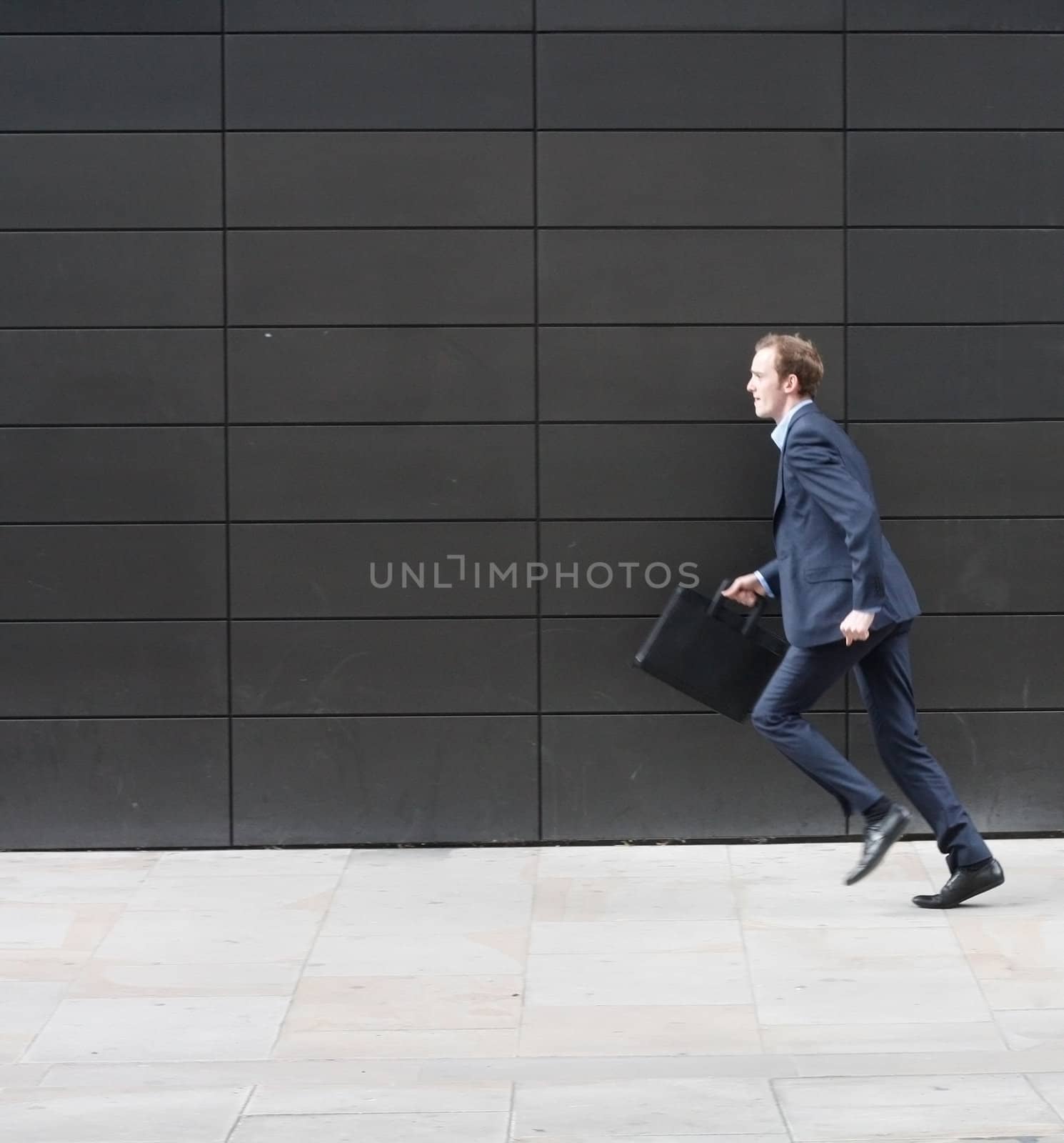 Business man running by leeser