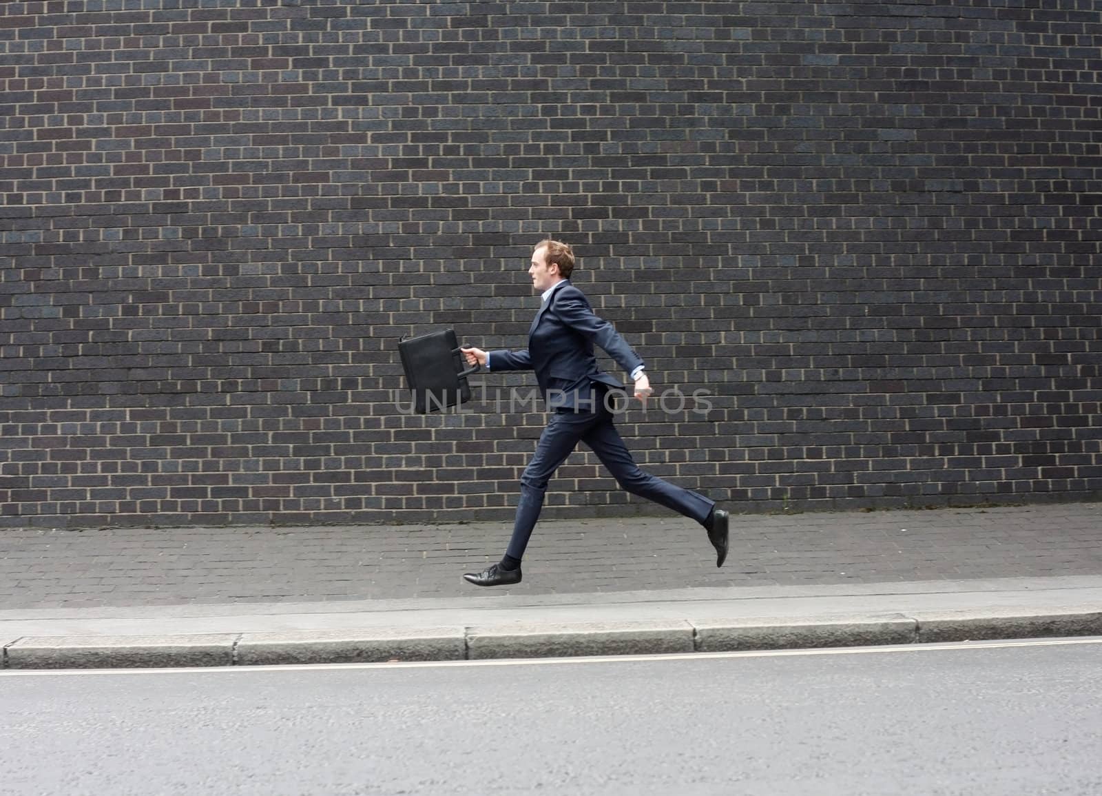 Business man running by leeser