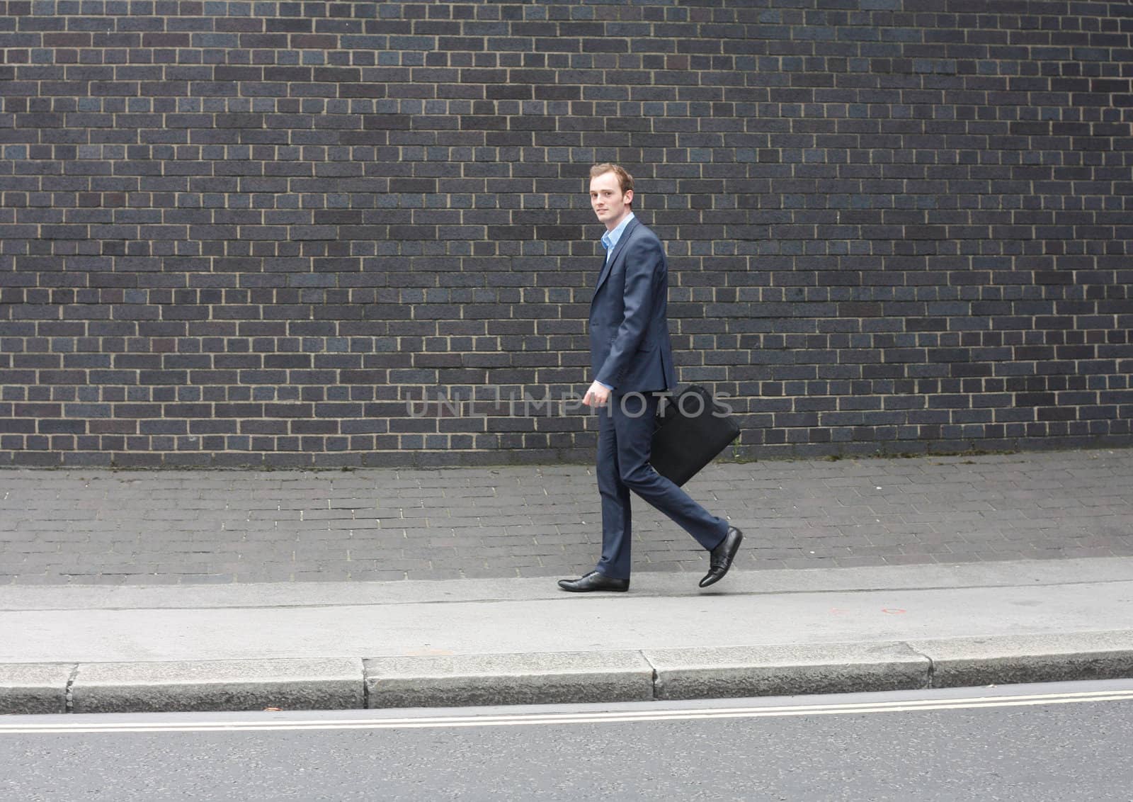 Business man running by leeser