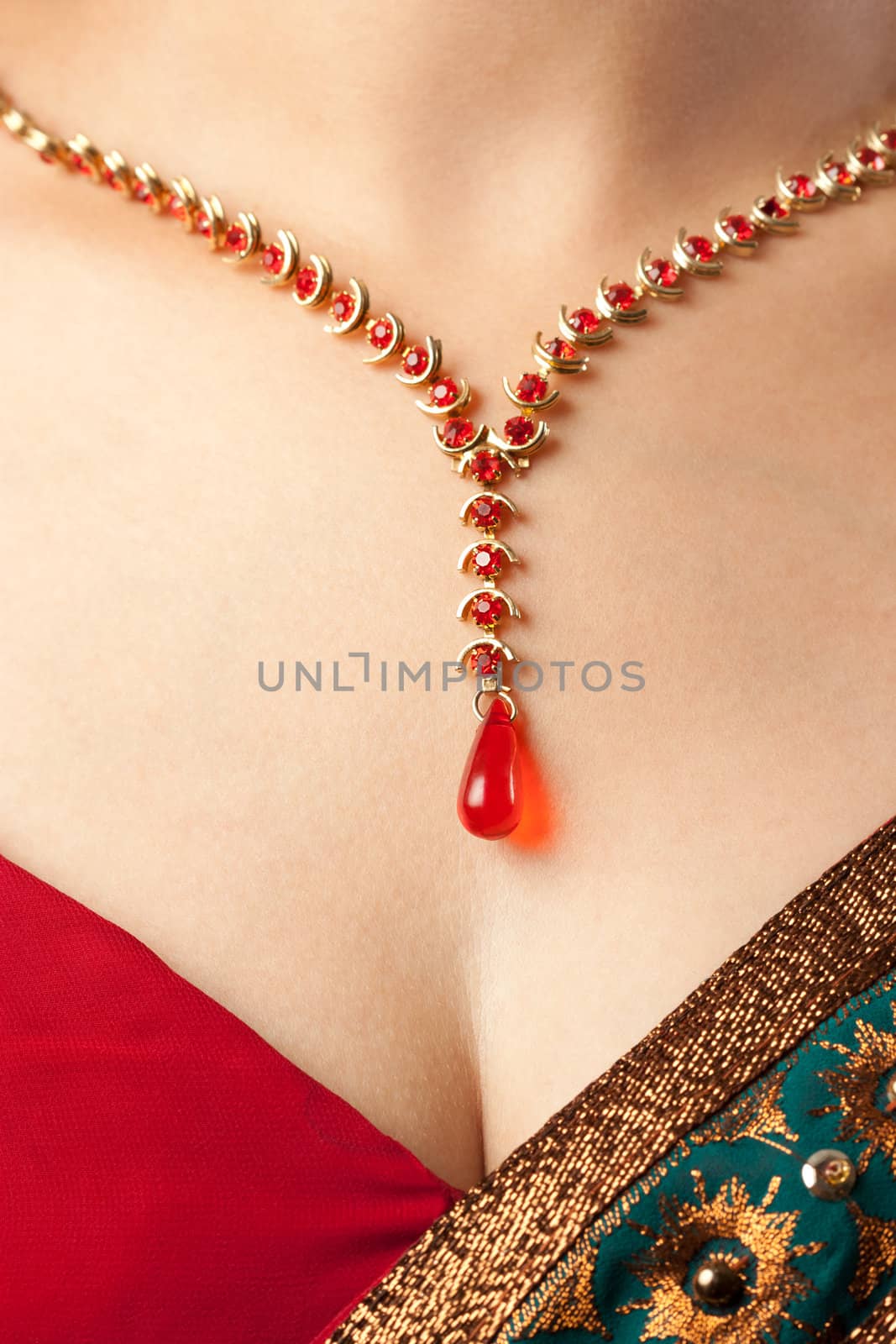 Close up of necklace over female body skin