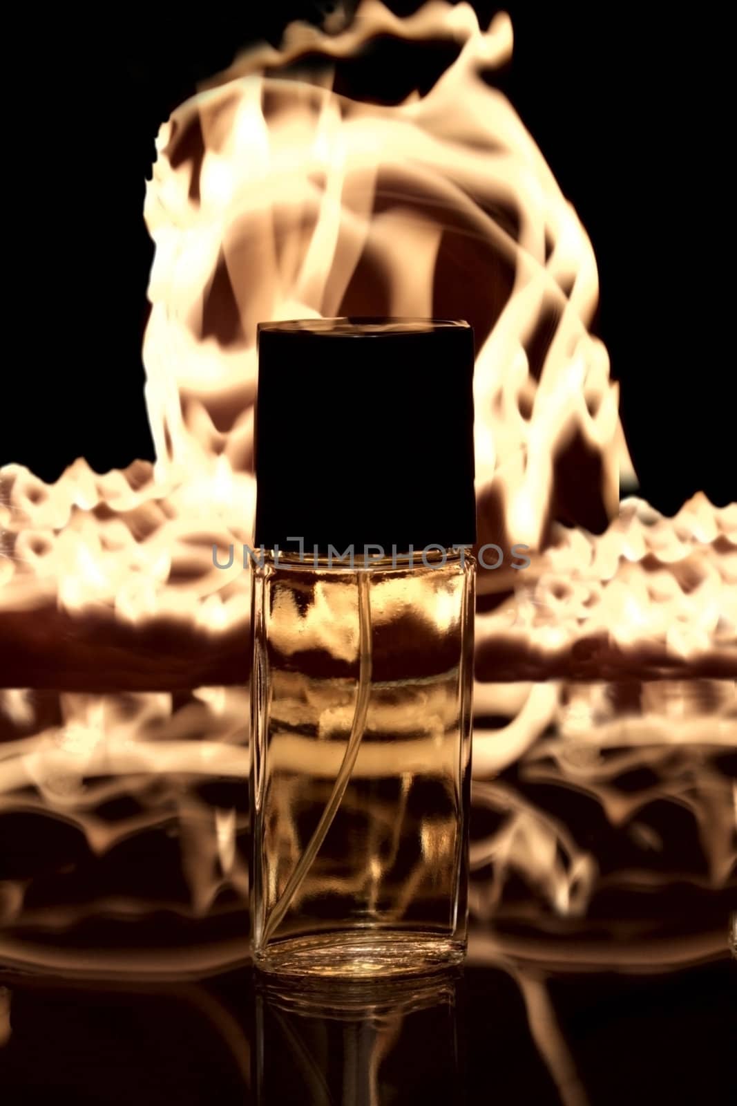 a bottle of aroma on the fire background
