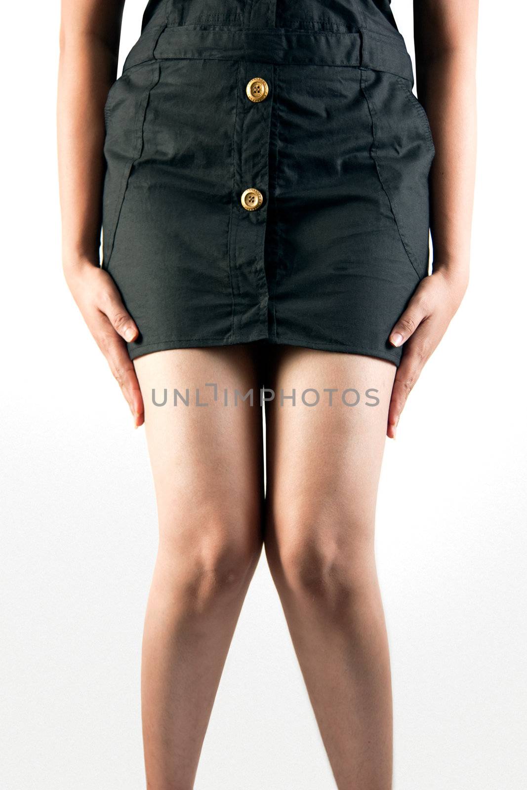 Closeup picture of woman hiding something between her legs