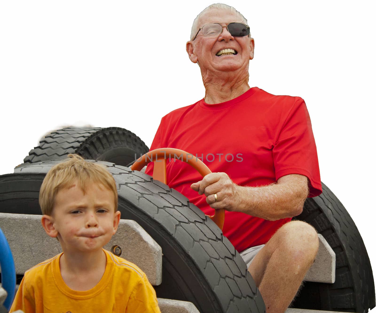 Boy and grandfather in playground car