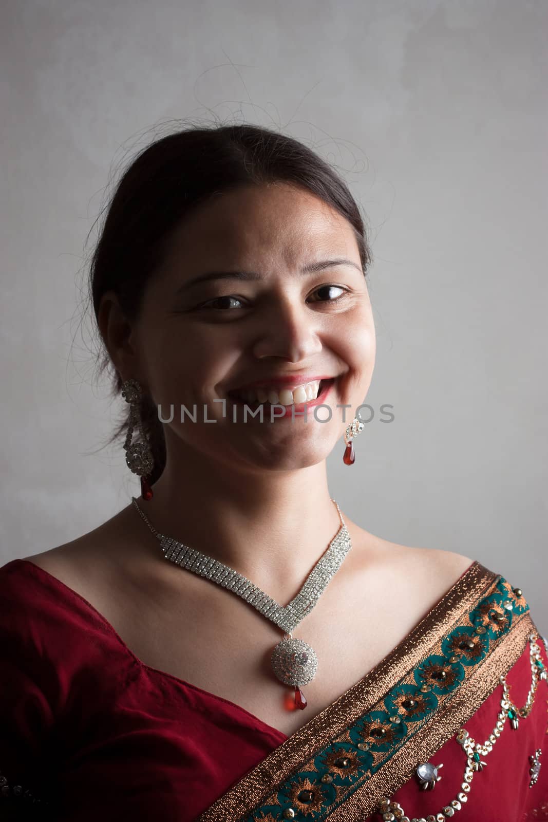 Beautiful Indian happy woman in red sari by ziprashantzi