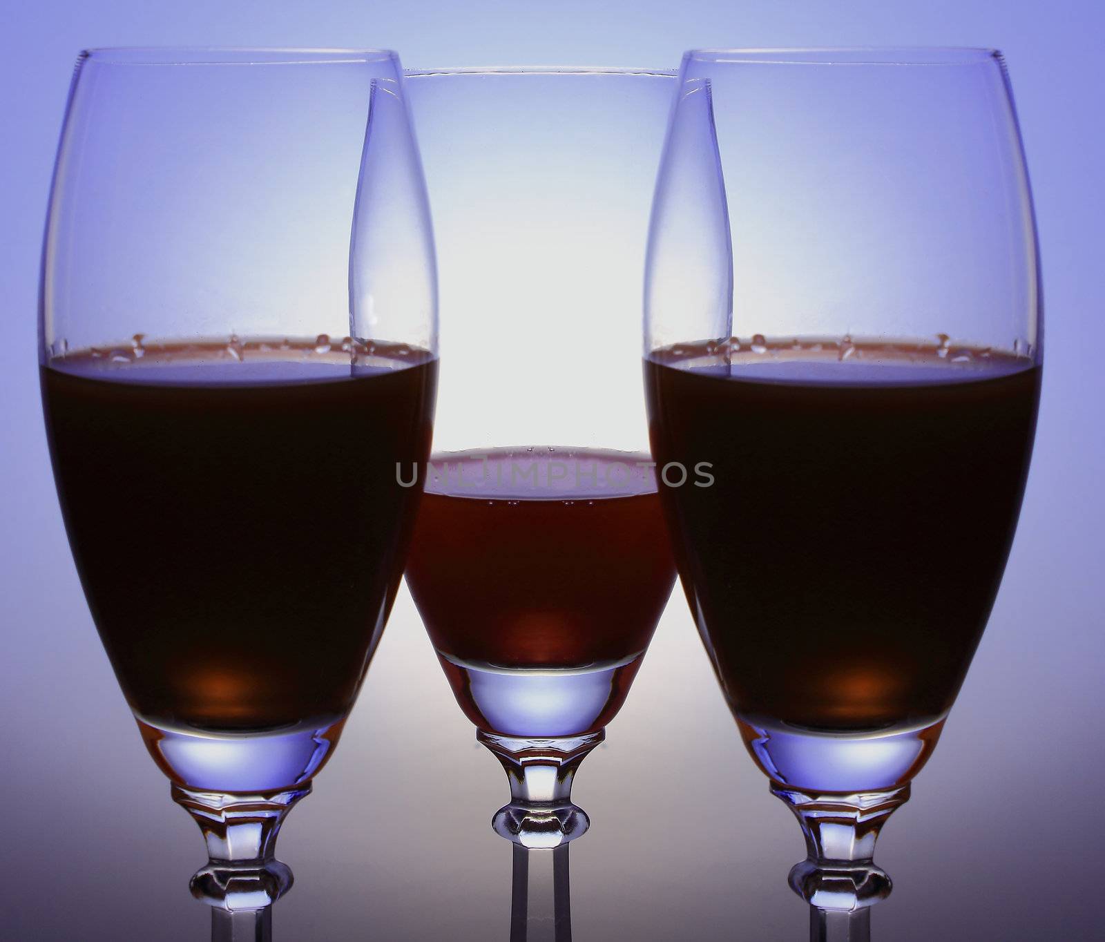 three glasses on the colored background