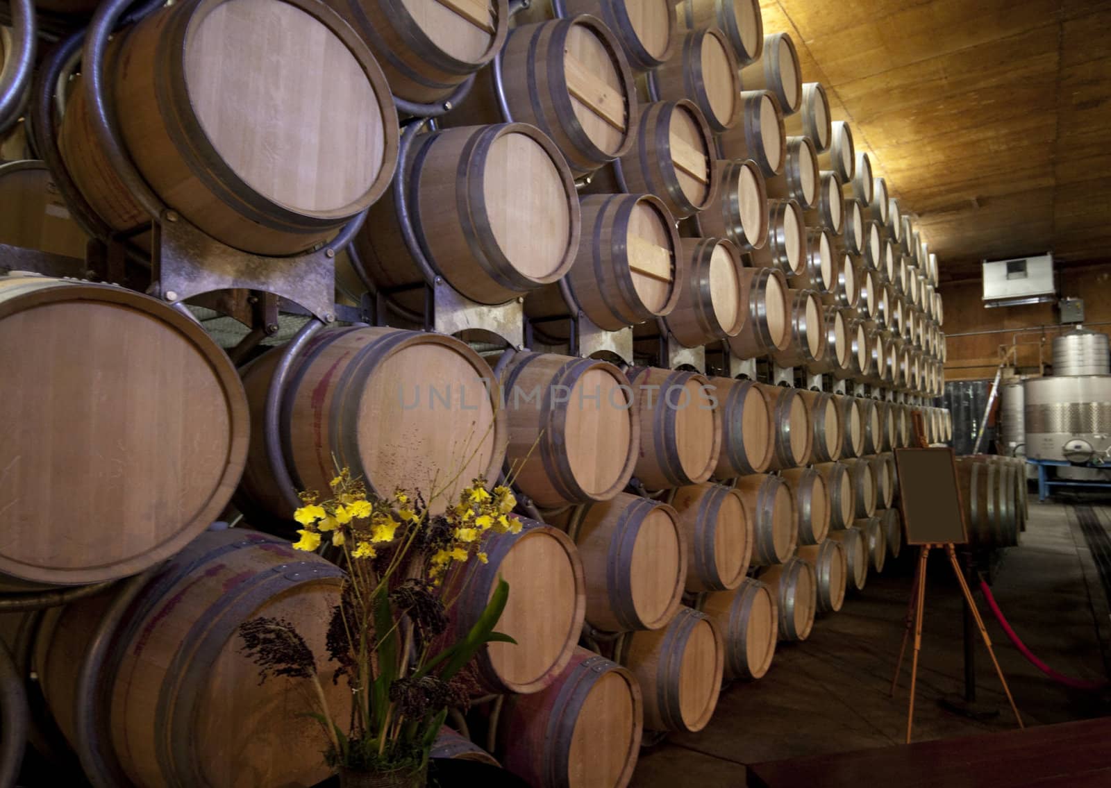 A large stack of barrels that are holding wine
