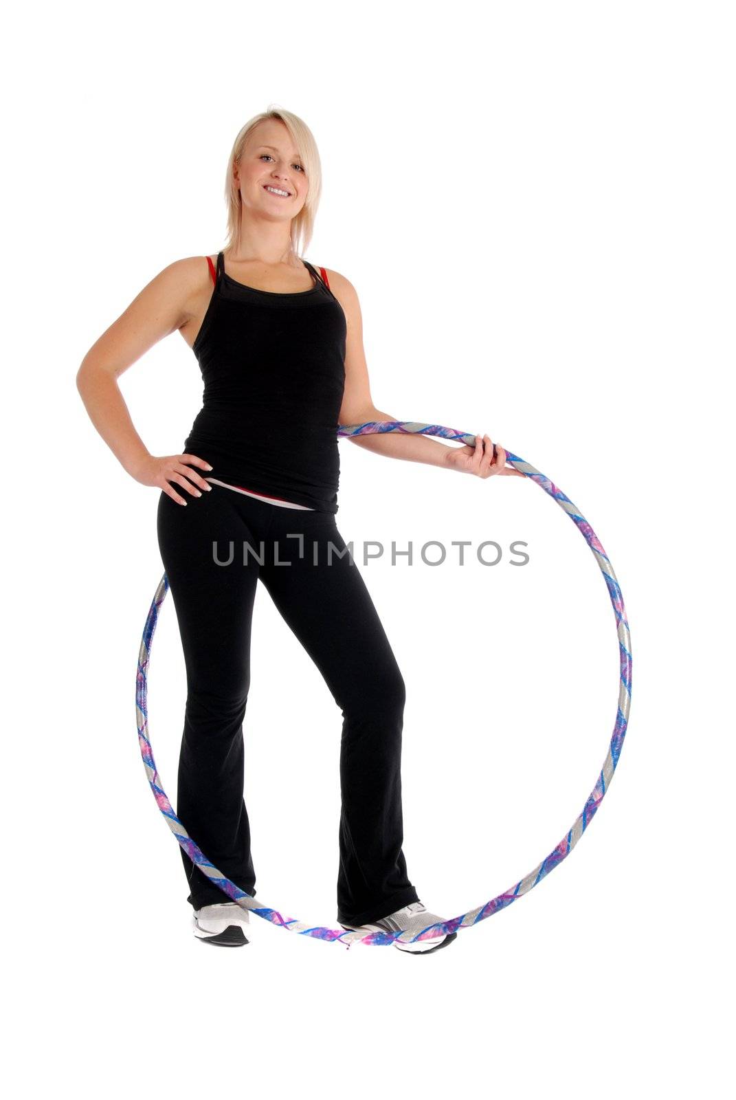 Fit blond woman holding a hula hoop, fitness theme.