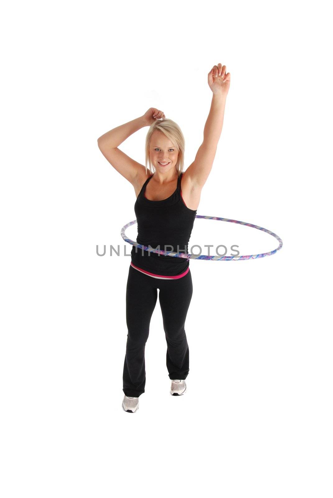 A blond woman exercising using a hula hoop
