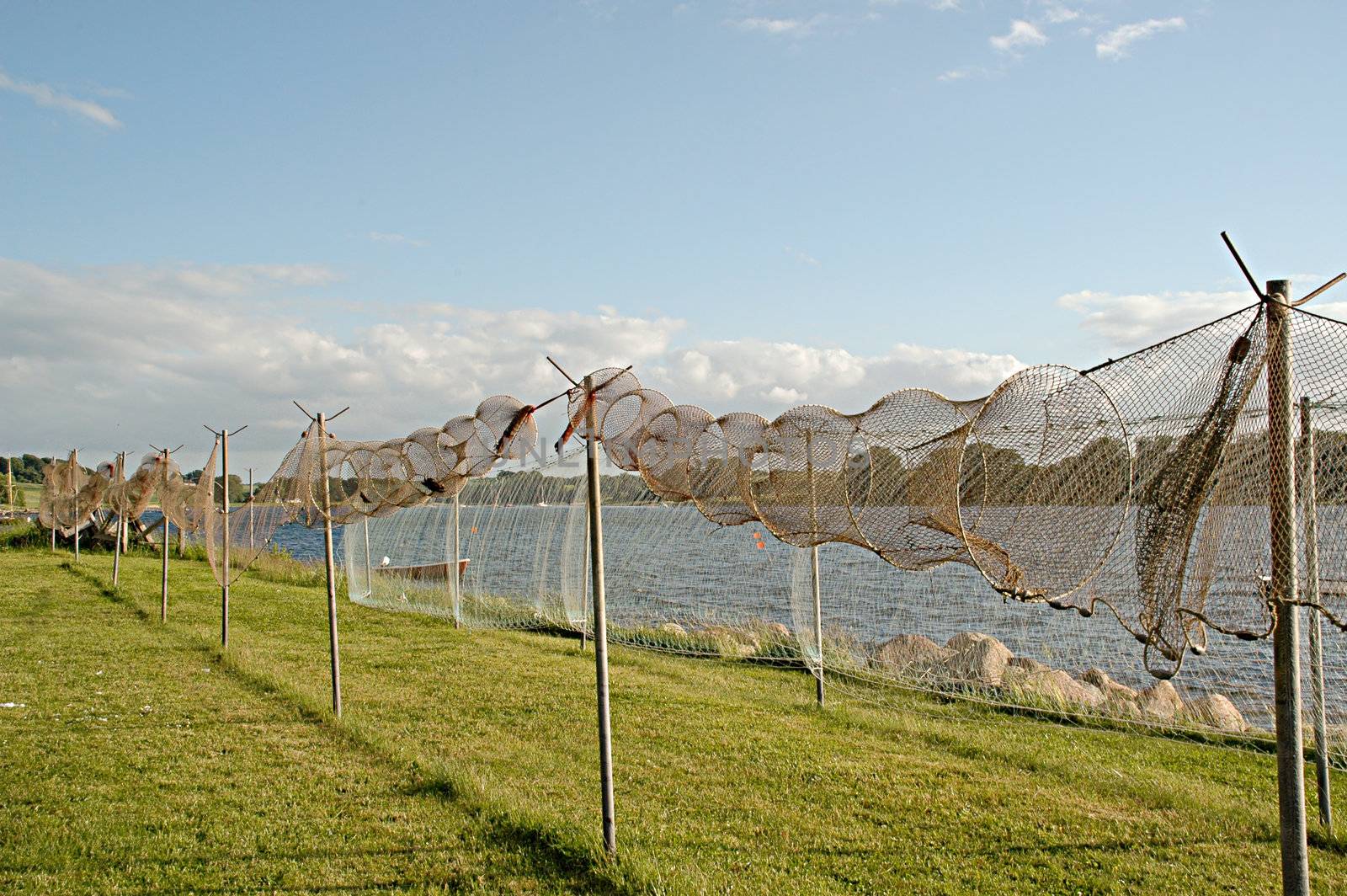 Fishing nets are on land ready for repair.