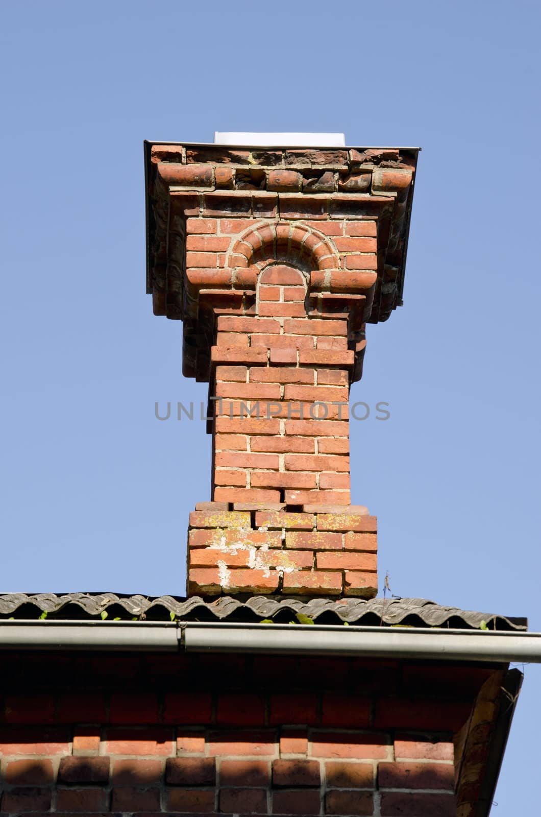 Antique red brick chimney. by sauletas