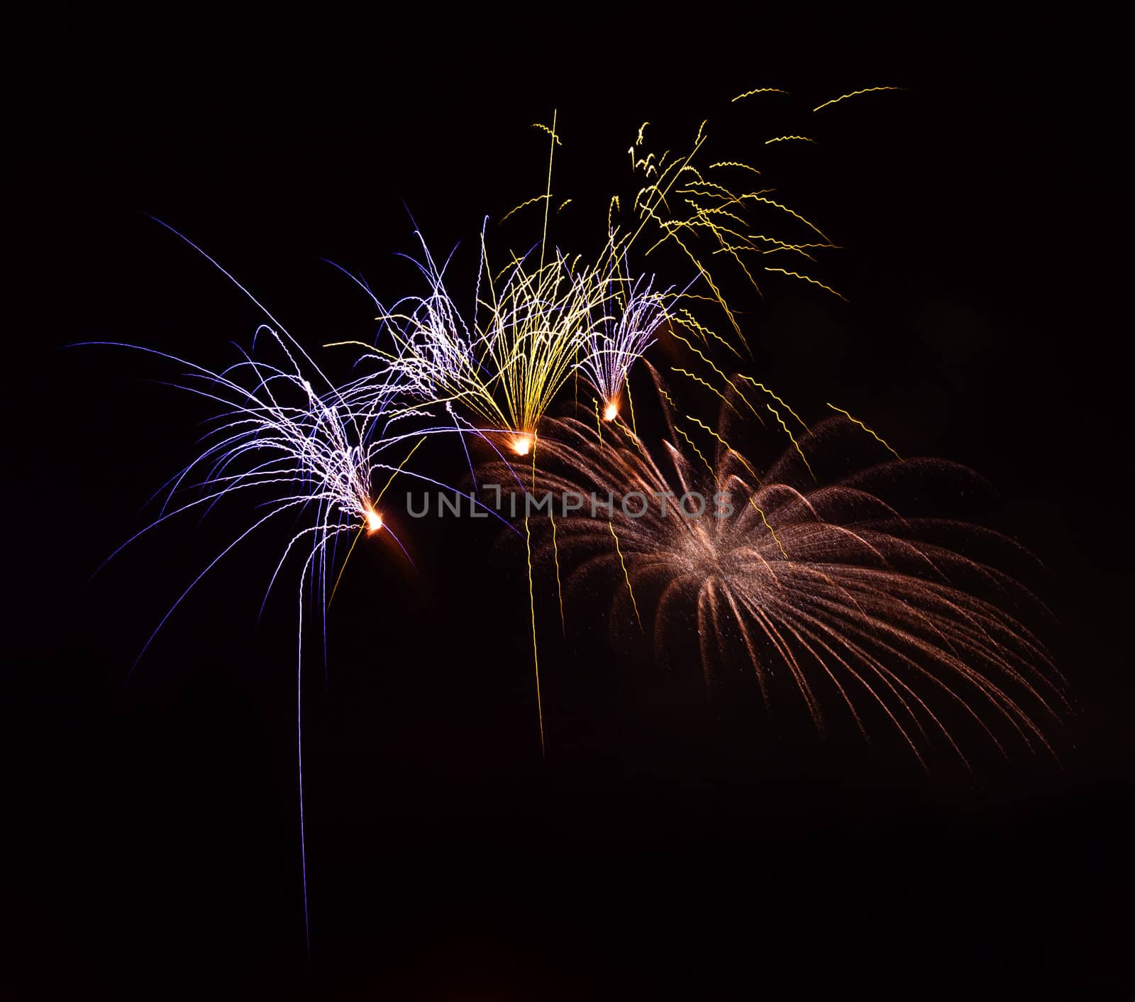 Firework display against black sky