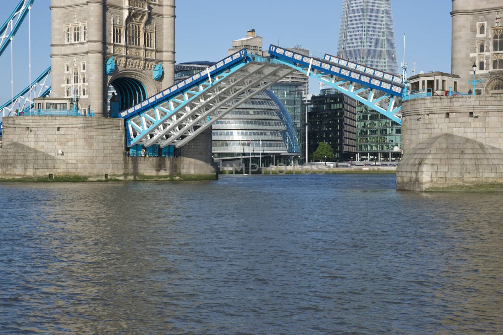 Tower Bridge in open position to allow passage of ships and boats. Historic bridge across the River Thames in London, England