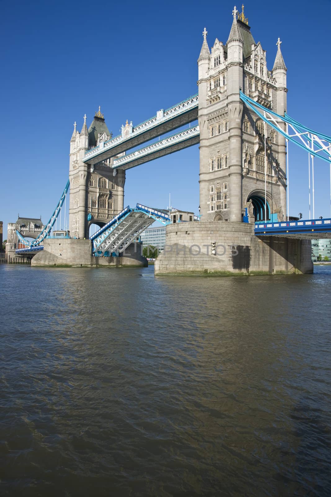 Tower Bridge in open position to allow passage of ships and boats. Historic bridge across the River Thames in London, England
